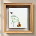 The Weight of Absence — front view, egg tempera teddy bear, broken chair and red balloon in natural oak shadow box